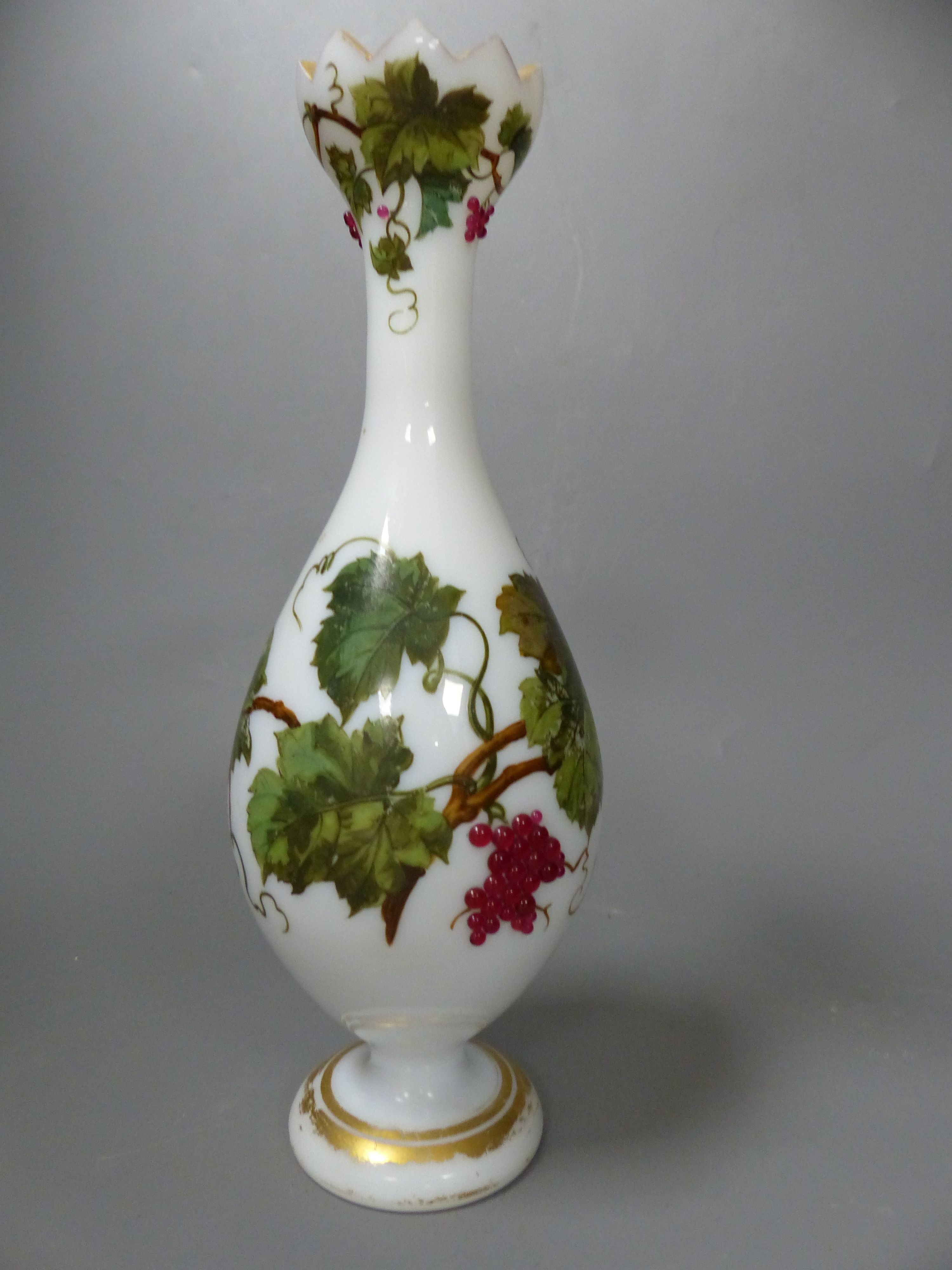 A French opaline glass vase with applied grapes and a pair of Webb style ruby and white glass vases, tallest 26cm